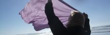 picture of a woman on the beach with a scarf in the wind, M. Hauk photographer